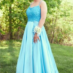 Prom dress is from The Ultimate, size 2, strap and length alterations